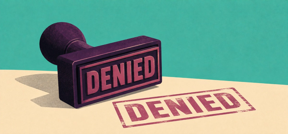 a rubber stamp for the word DENIED