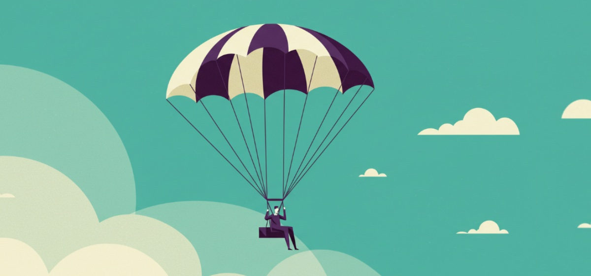 a person riding a parachute in the sky