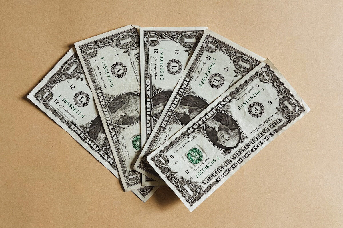 five one-dollar bills