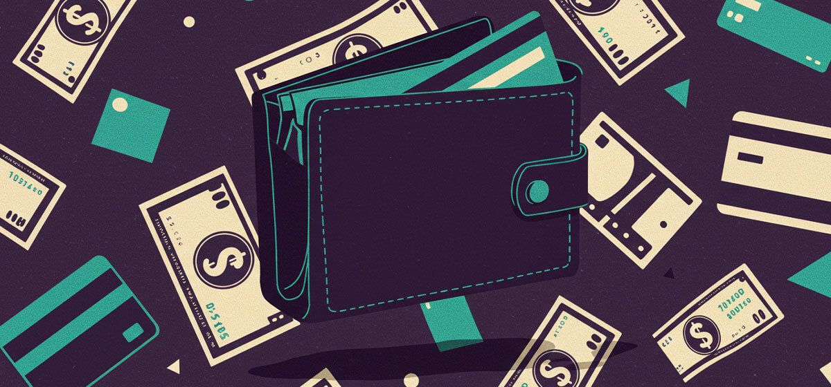 A wallet with dollar bills and credit cards in the background