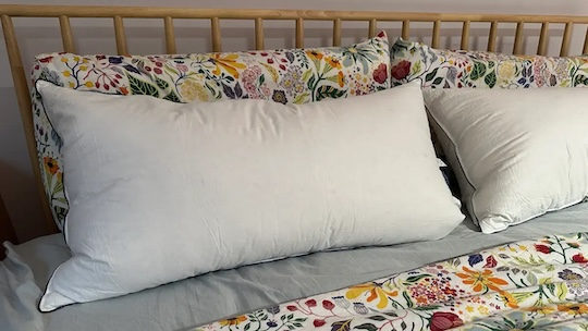 A down pillow with a secret middle layer. It works.