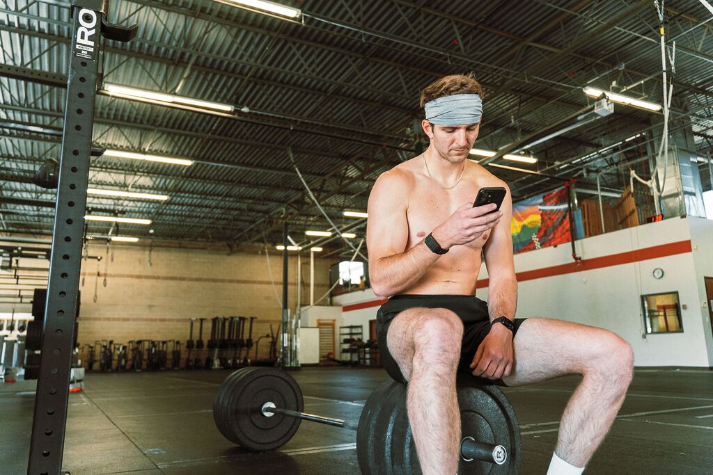 Athlete looking at his phone 