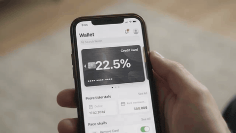 Hand holding smartphone showing digital wallet app