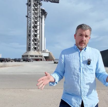 Man in front of a tower