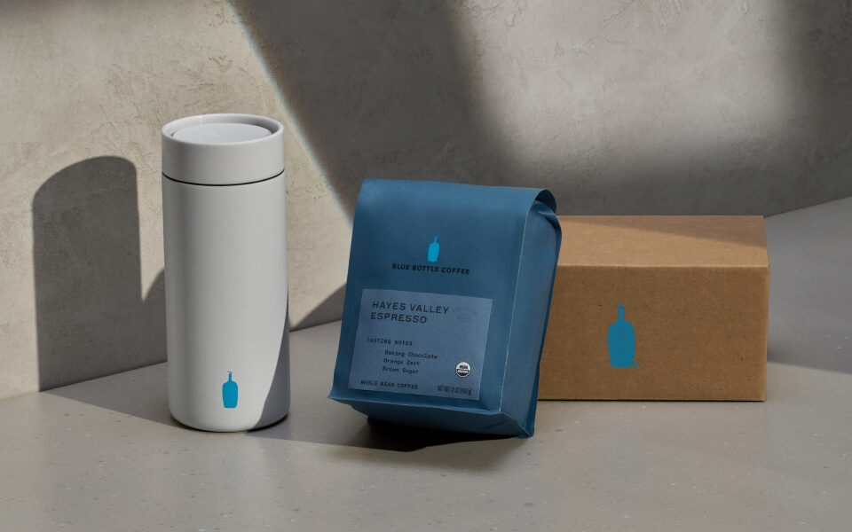 Image of coffee bag, drinkware and delivery box.