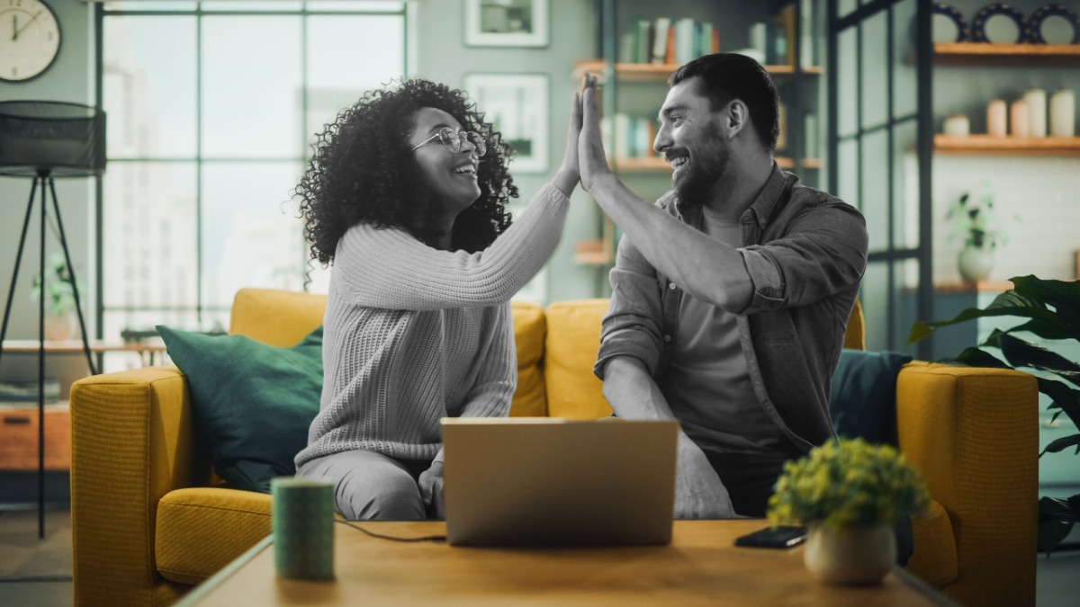 Woman and man high-fiving each other