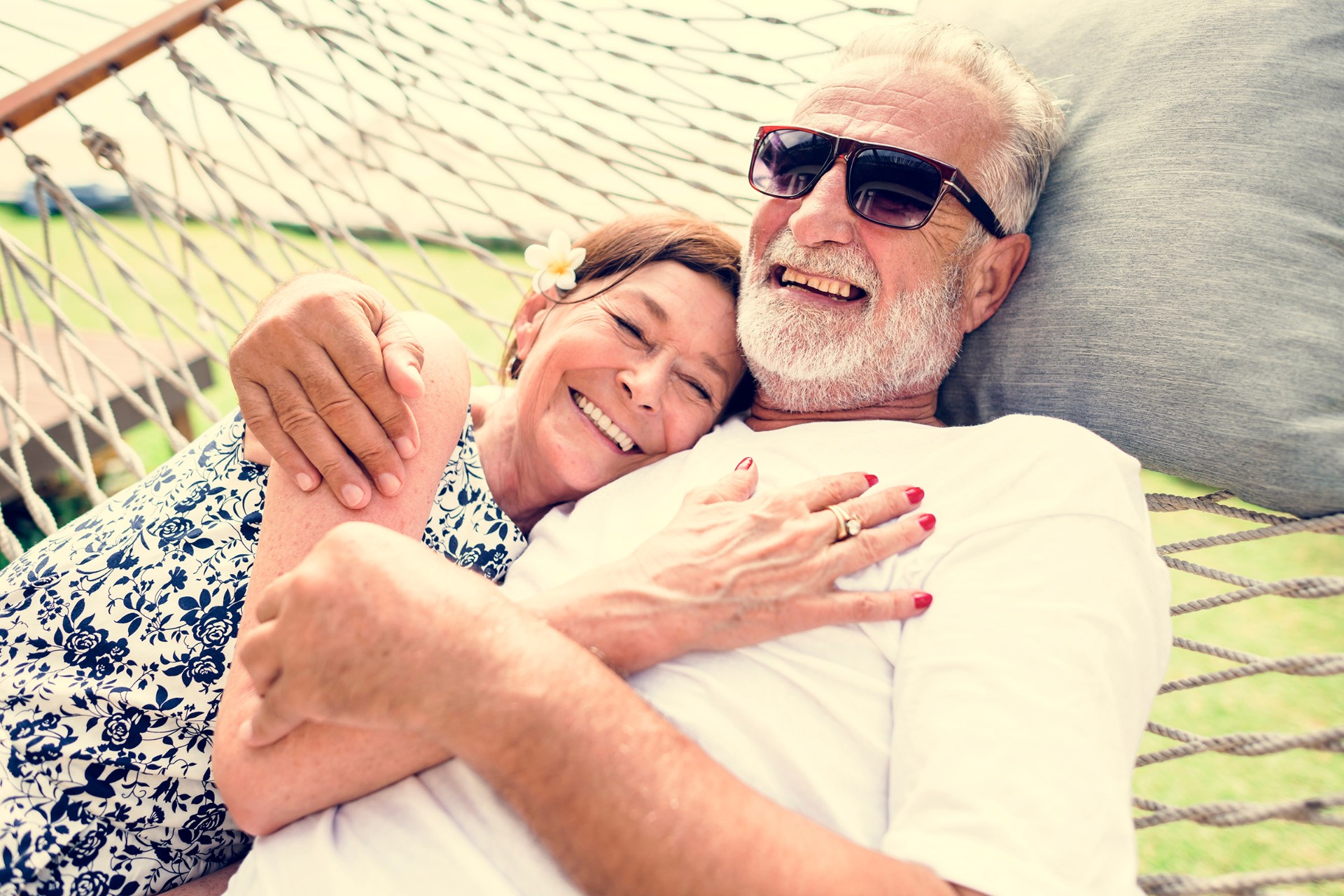 Older couple chilling in a hammock