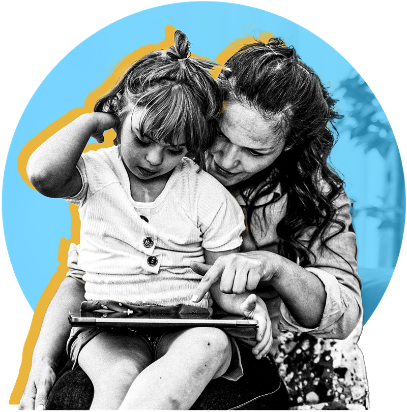 Child sitting on her mom's lap