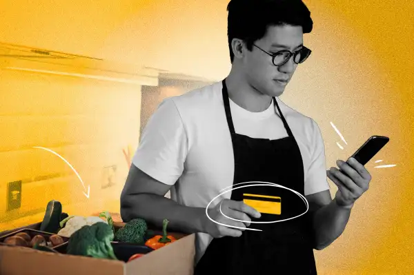 man buying something with credit card on phone