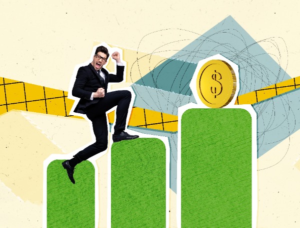 Man running up a bar graph toward a gold coin