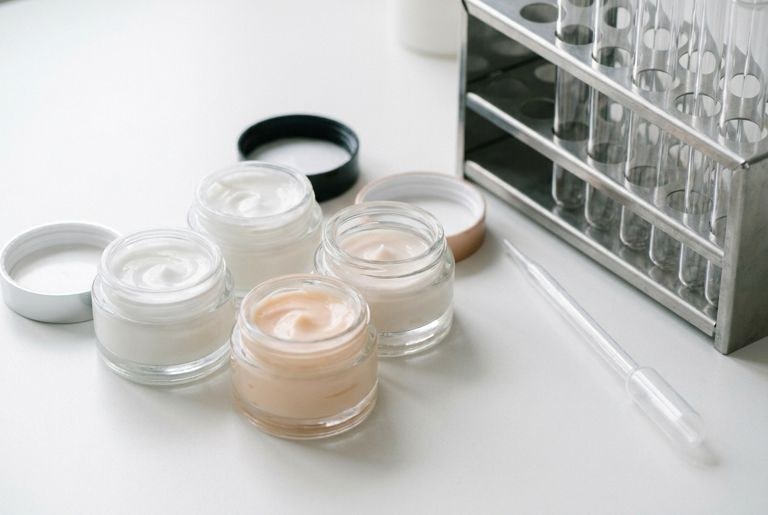 Cream jars in lab