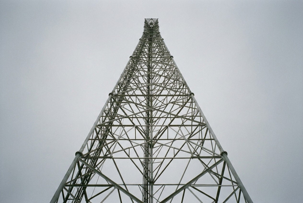 Antenna mast against clouds
