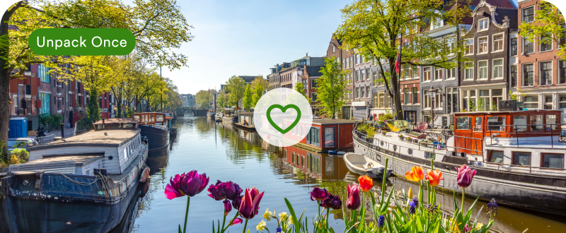 Amsterdam canal houses with wish list heart — explore A Week in Amsterdam tour