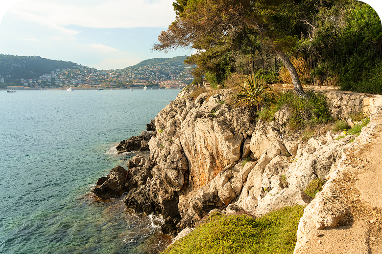 Cap Ferrat cliff path over turquoise Mediterranean water on French Riviera & Provence — opens itinerary.