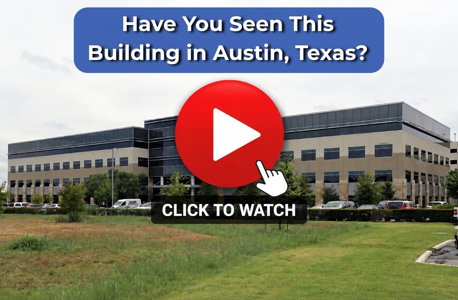 Modern office building with red play button