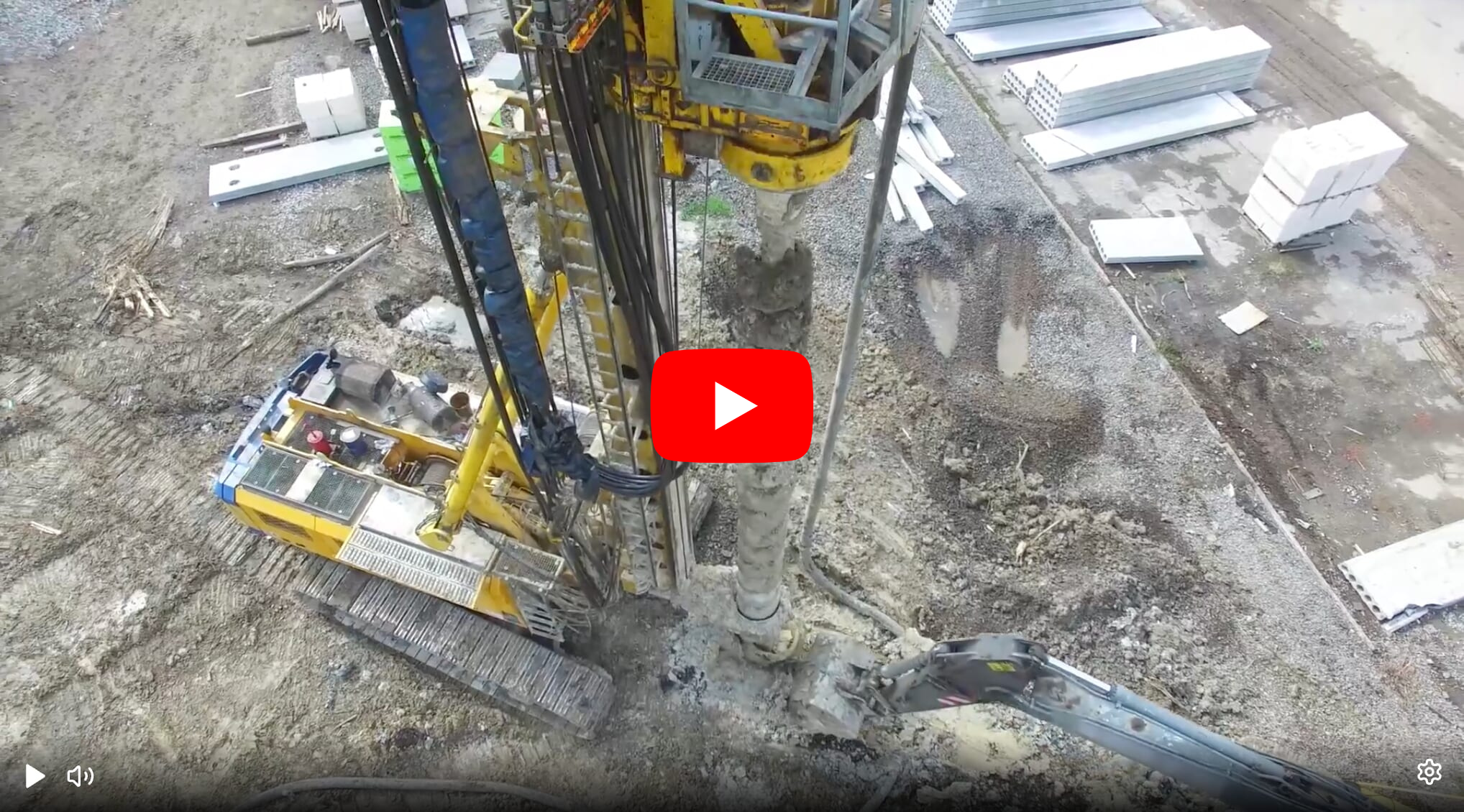 Yellow drilling rig at a construction site