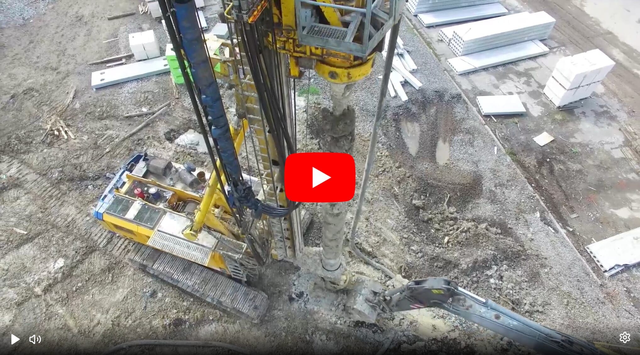Yellow drilling rig at a construction site