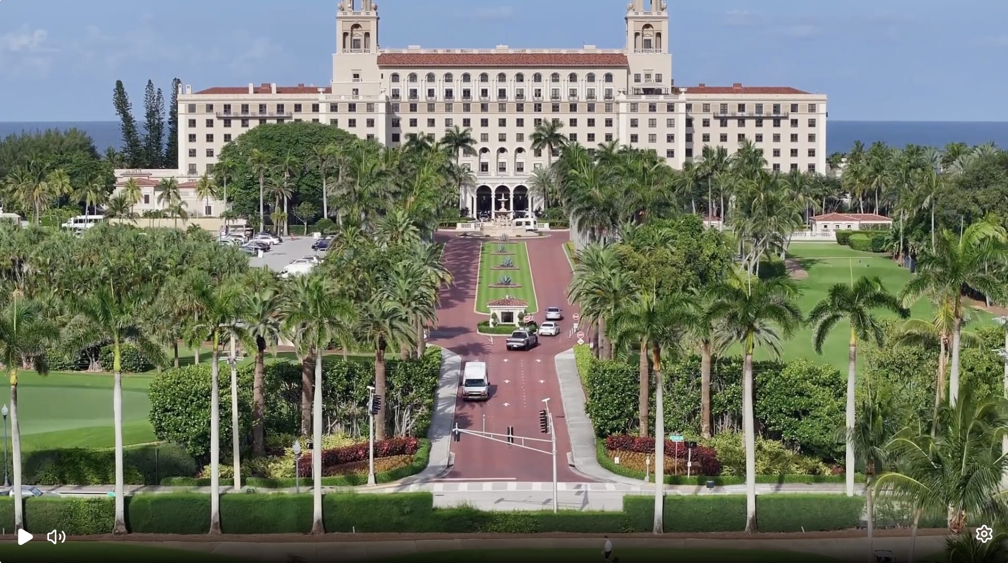 Large resort hotel surrounded by palm trees