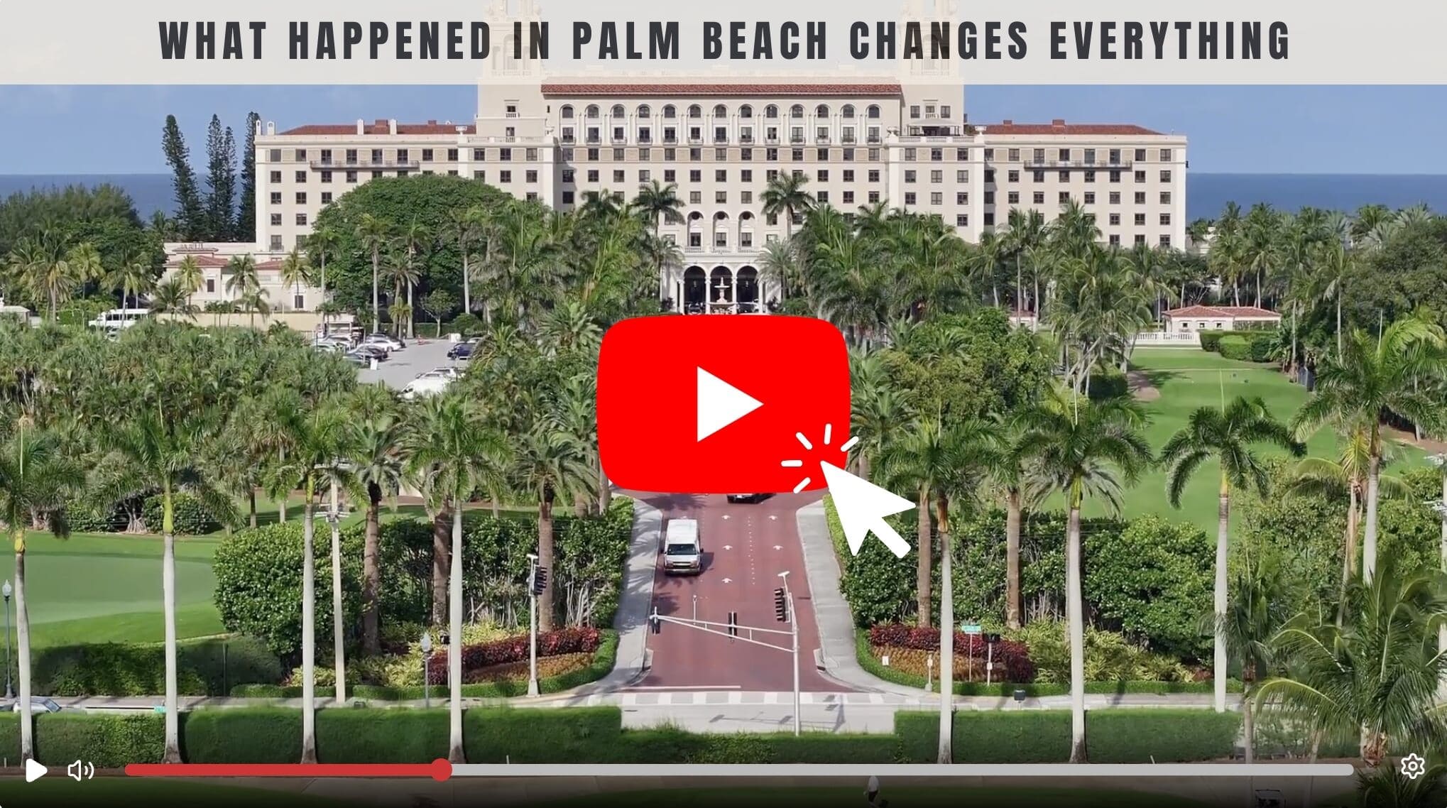 Large resort hotel surrounded by palm trees