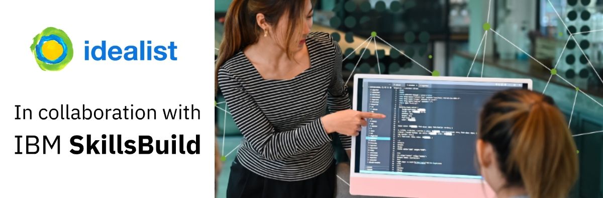 woman showing another woman data on computer screen