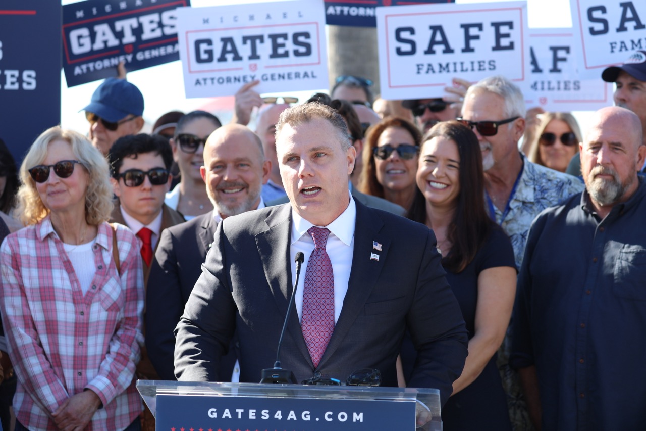 Michael Gates speaking with supporters