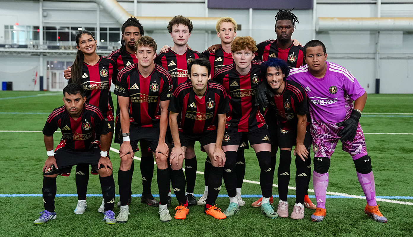 Atlanta United Unified poses on the field.