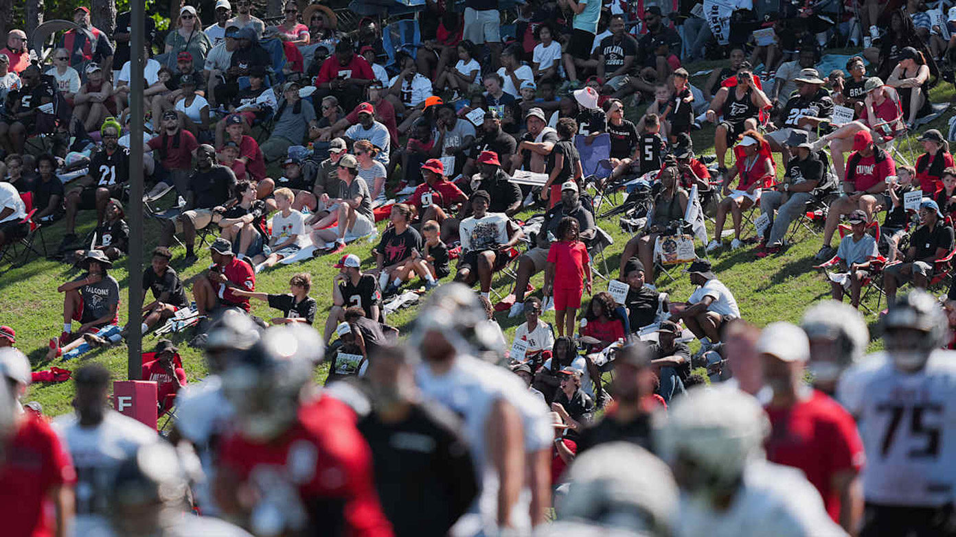 A crowd watches the Falcons practice