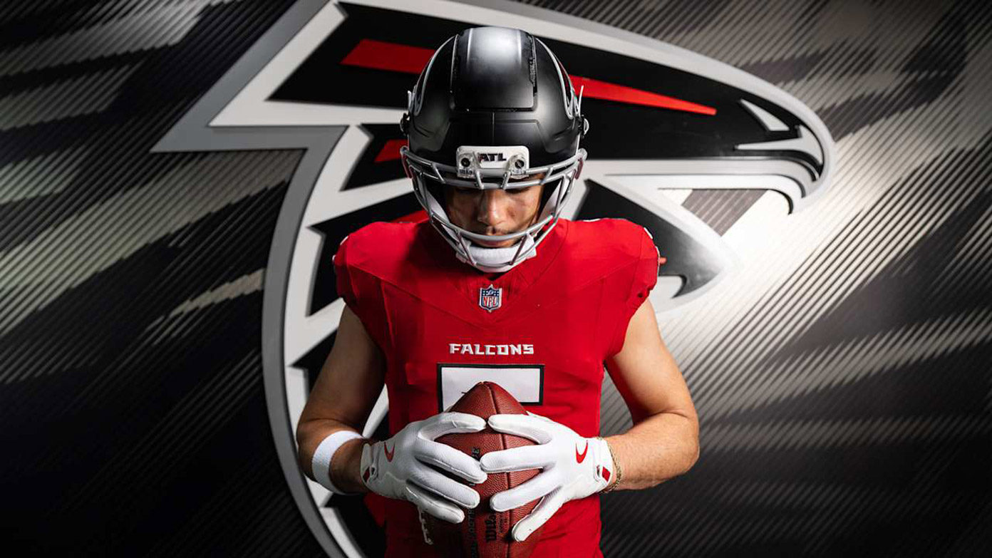 Drake London posing with football
