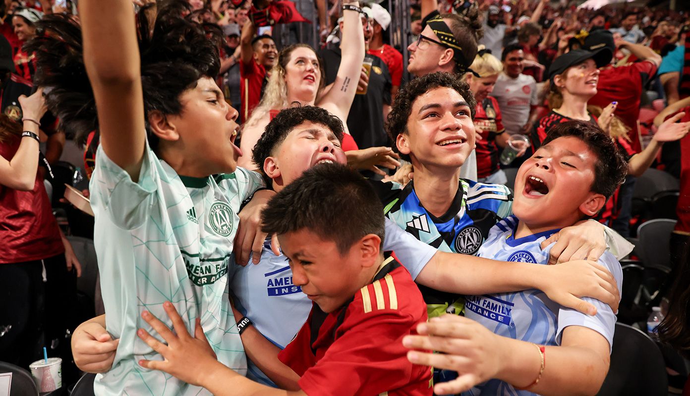 Young 17s cheering during an Atlanta United game