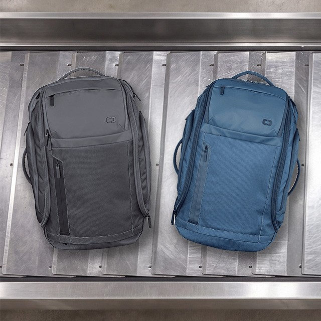 White Vault Luggage on baggage claim
