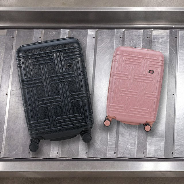 Black and Mahogany Rose Rise Luggage on baggage claim