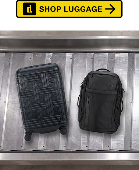 White Vault and Graphite Layover luggage on baggage claim