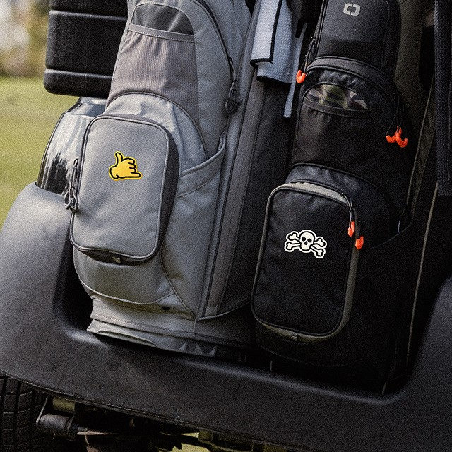 2 golf bags with custom patches on the front pocket