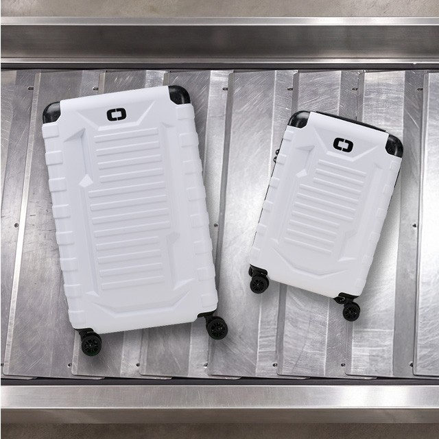 White Vault Luggage on baggage claim
