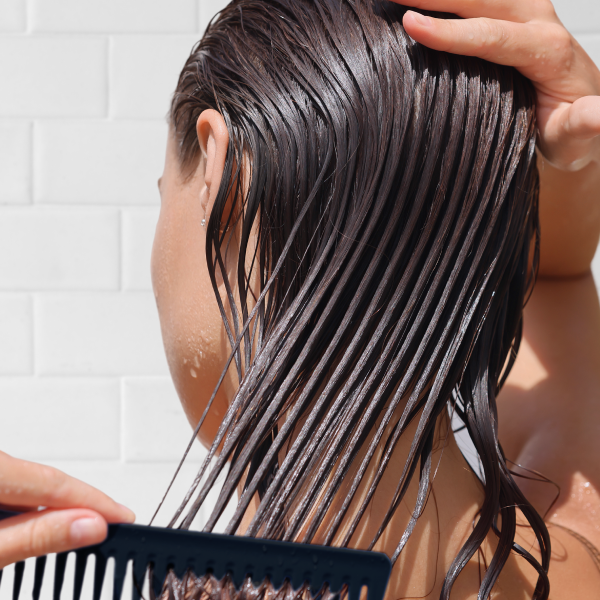 woman combing hair