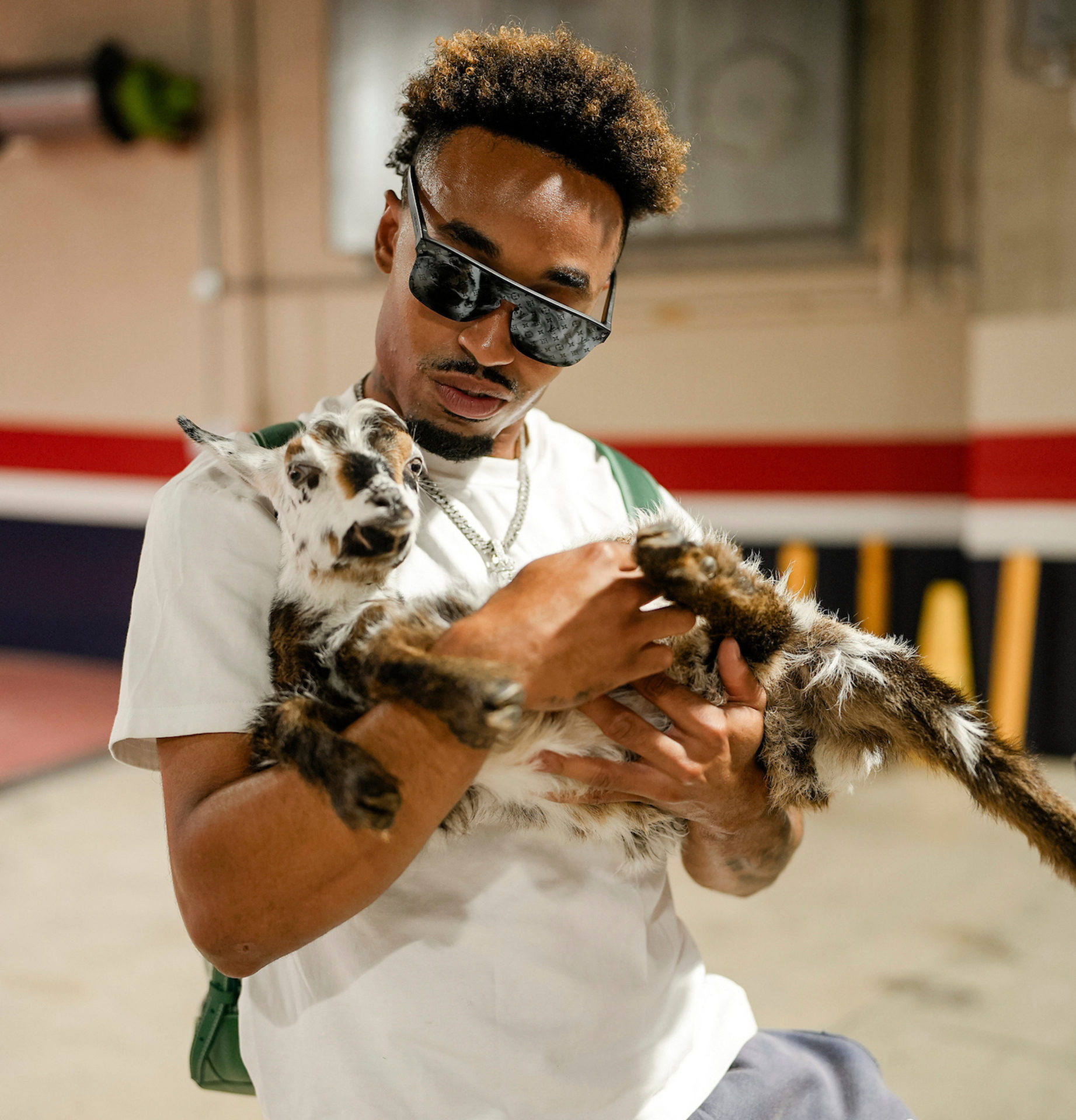 Nasim Nuñez with a goat 