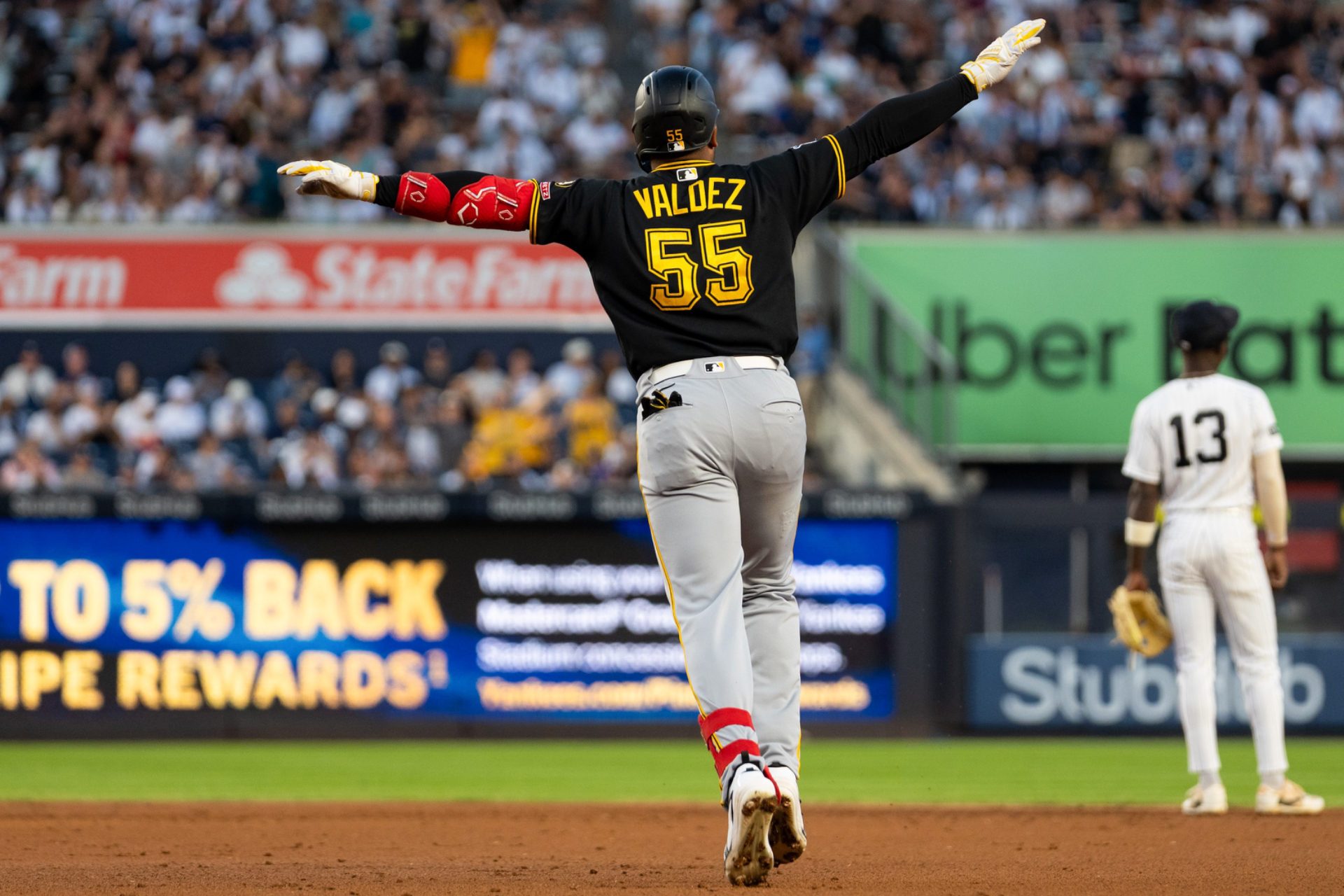 Esmerlyn Valdez celebrates as he rounds the bases.