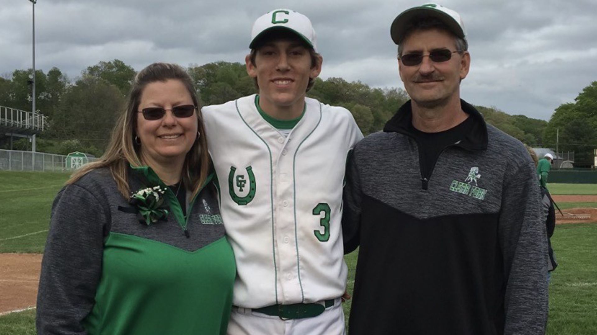 AJ Blubaugh with parents Erin and Reggie