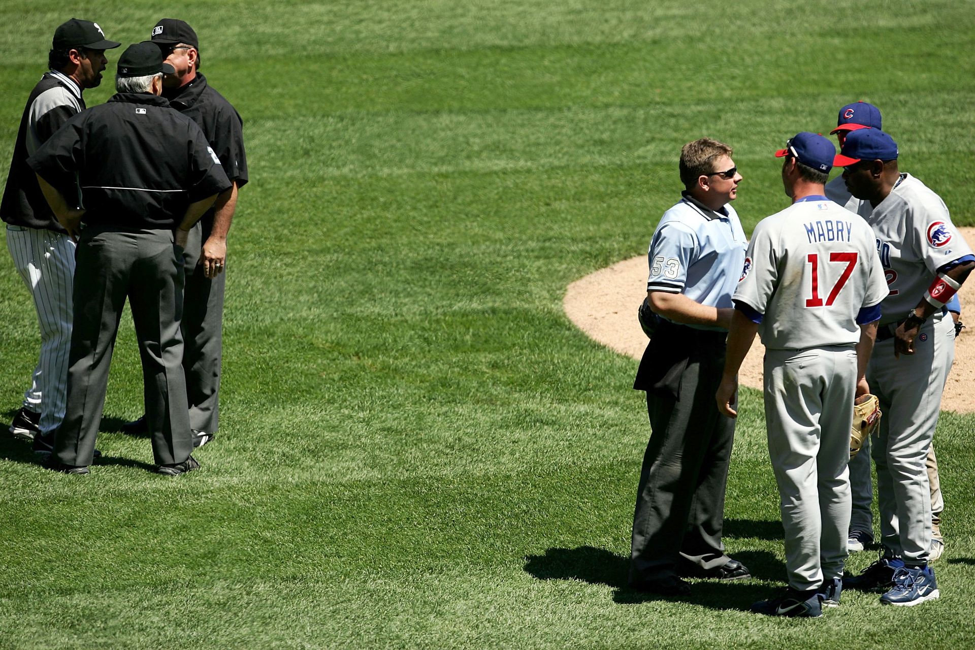 Ozzie Guillen and Dusty Baker talking with umpires after infamous A.J. Pierzynski/Michael Barrett brawl