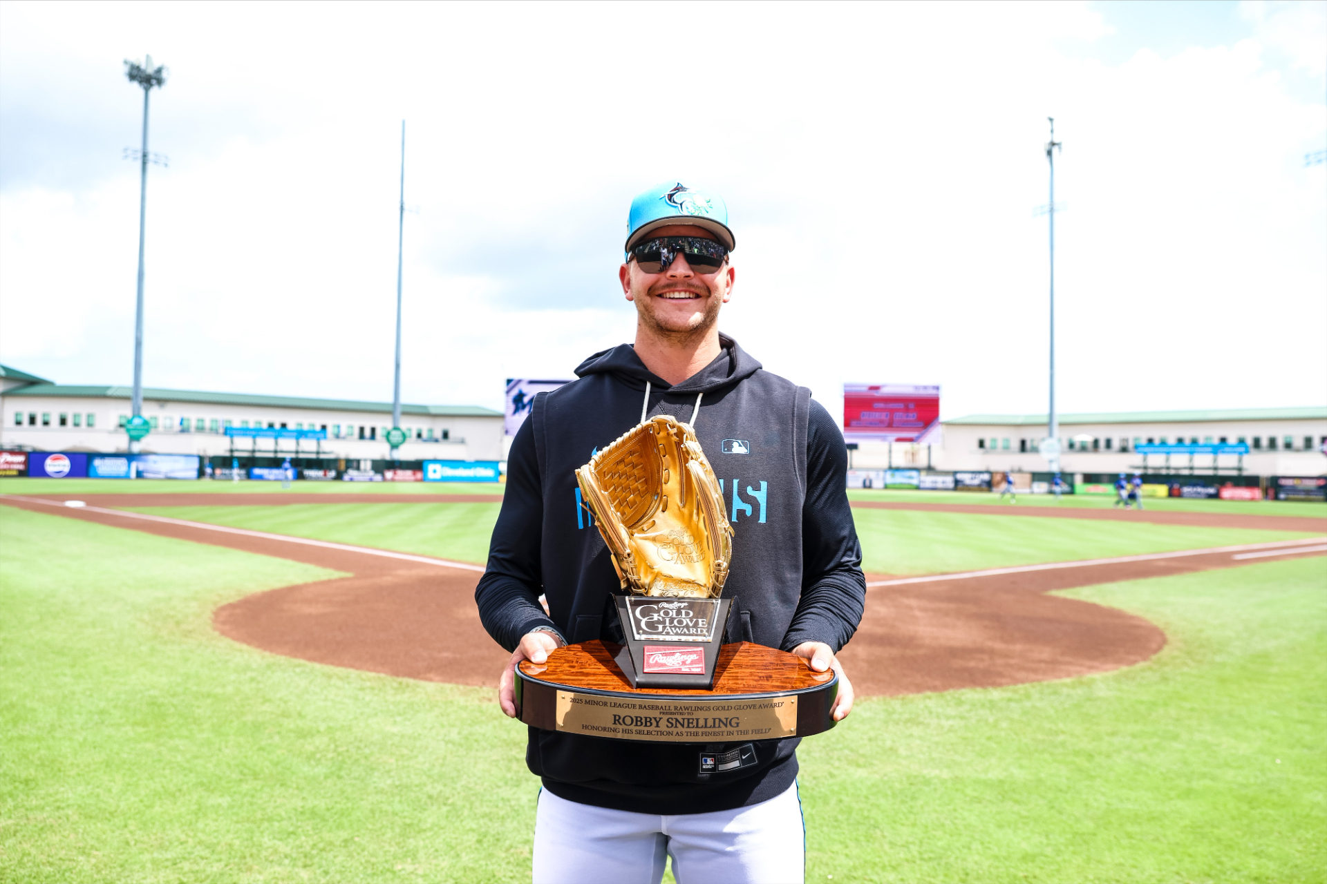 Robby Snelling with Gold Glove Award
