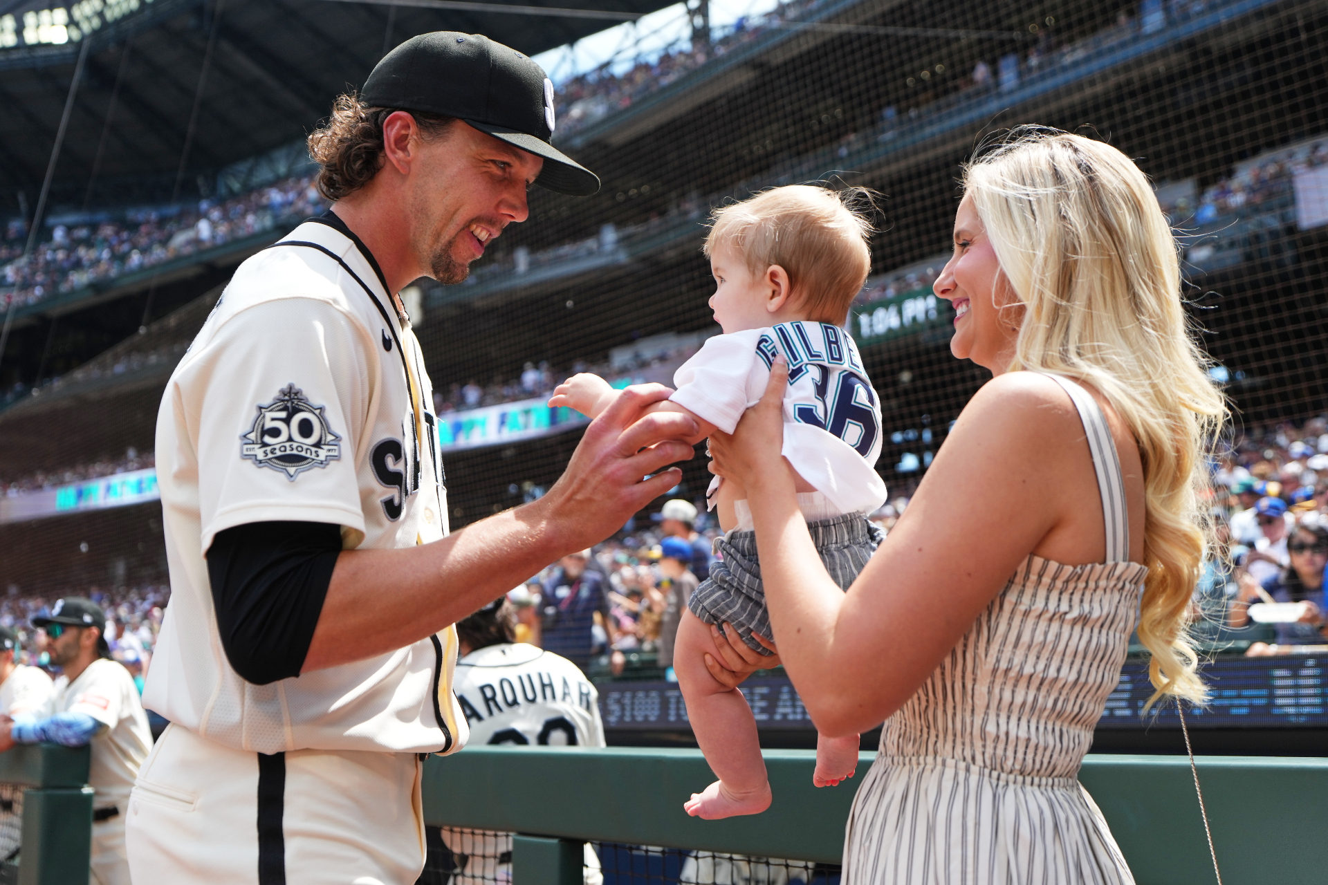 Logan Gilbert with baby Henry