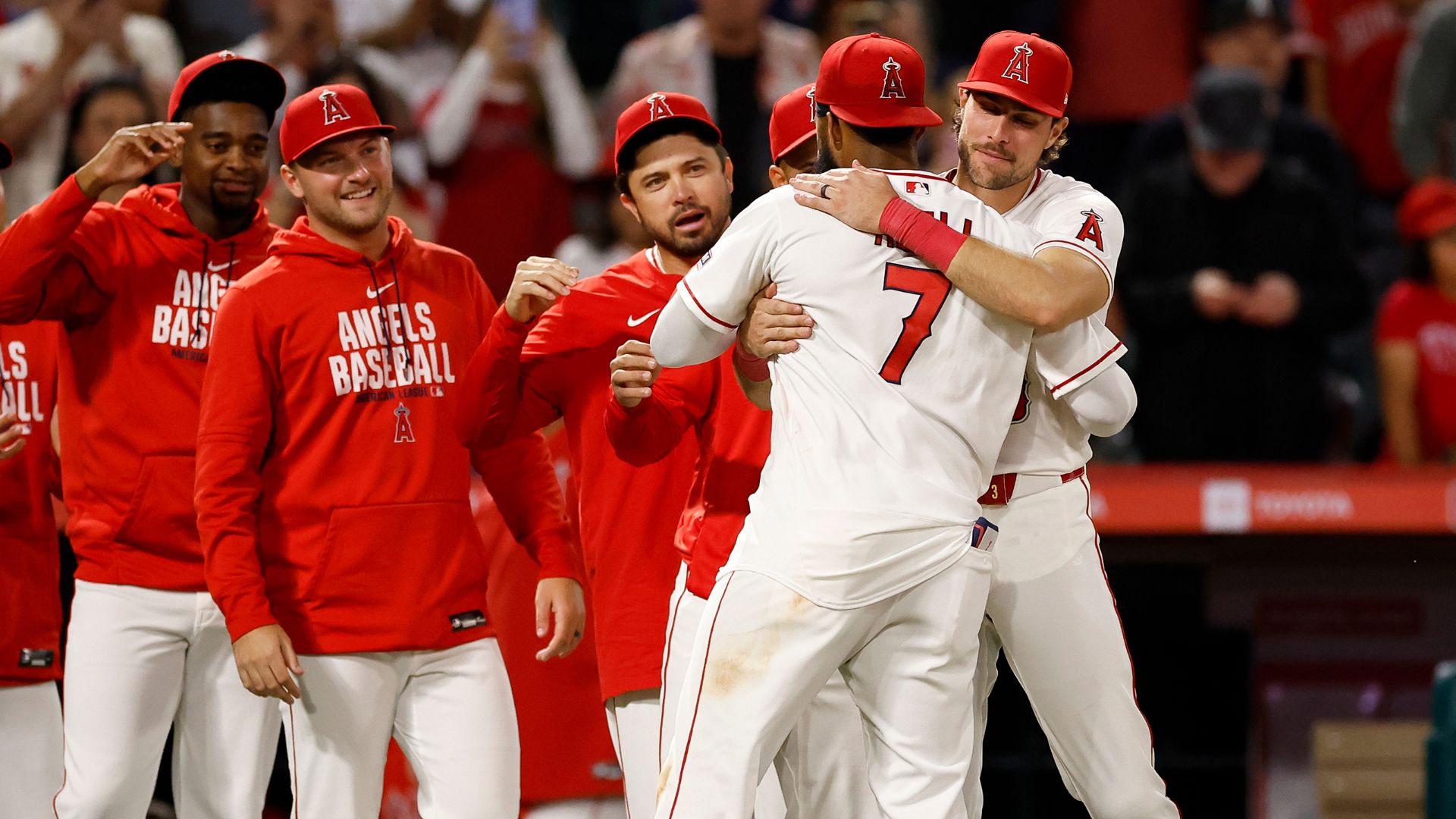 Jo Adell being congratulated by team