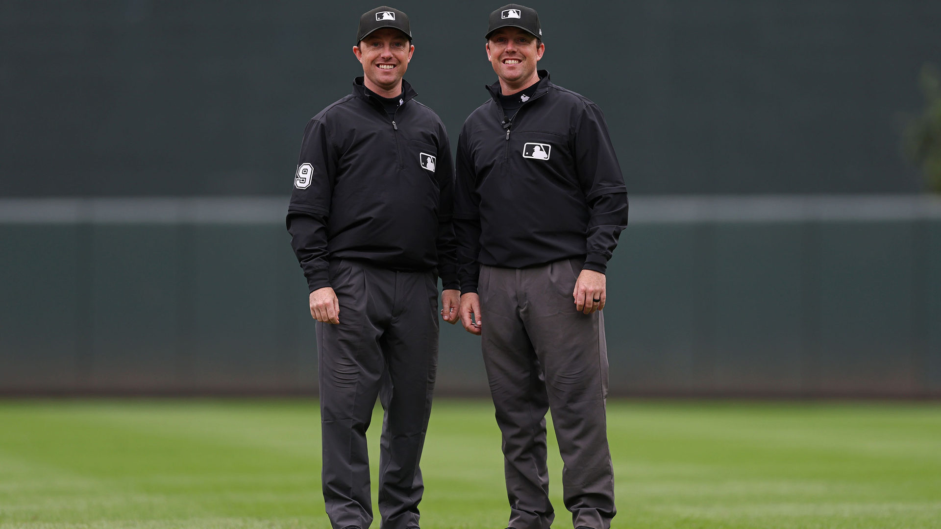 Umpires Austin and Tyler Jones, who are identical twins