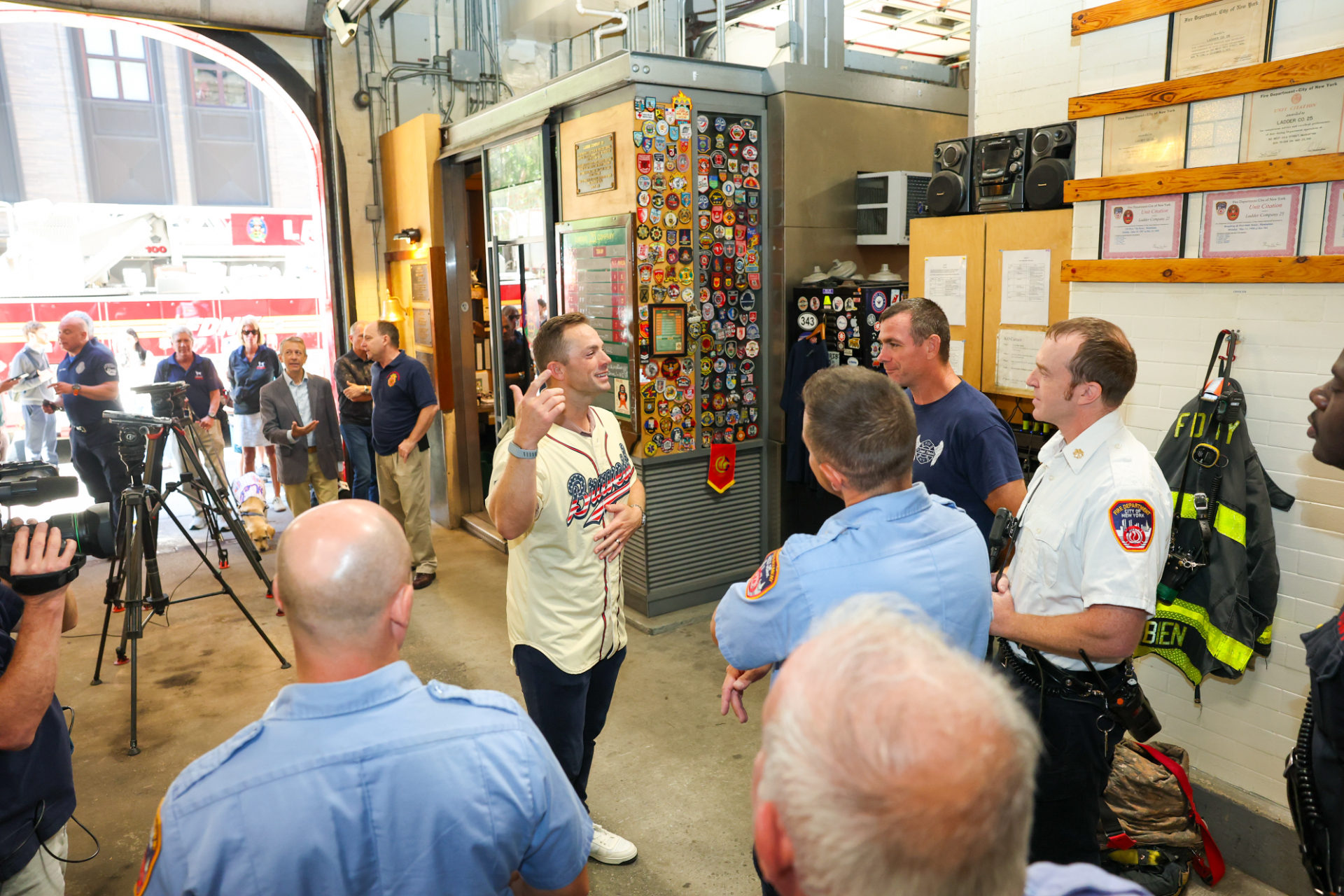 David Wright speaks with firefighters