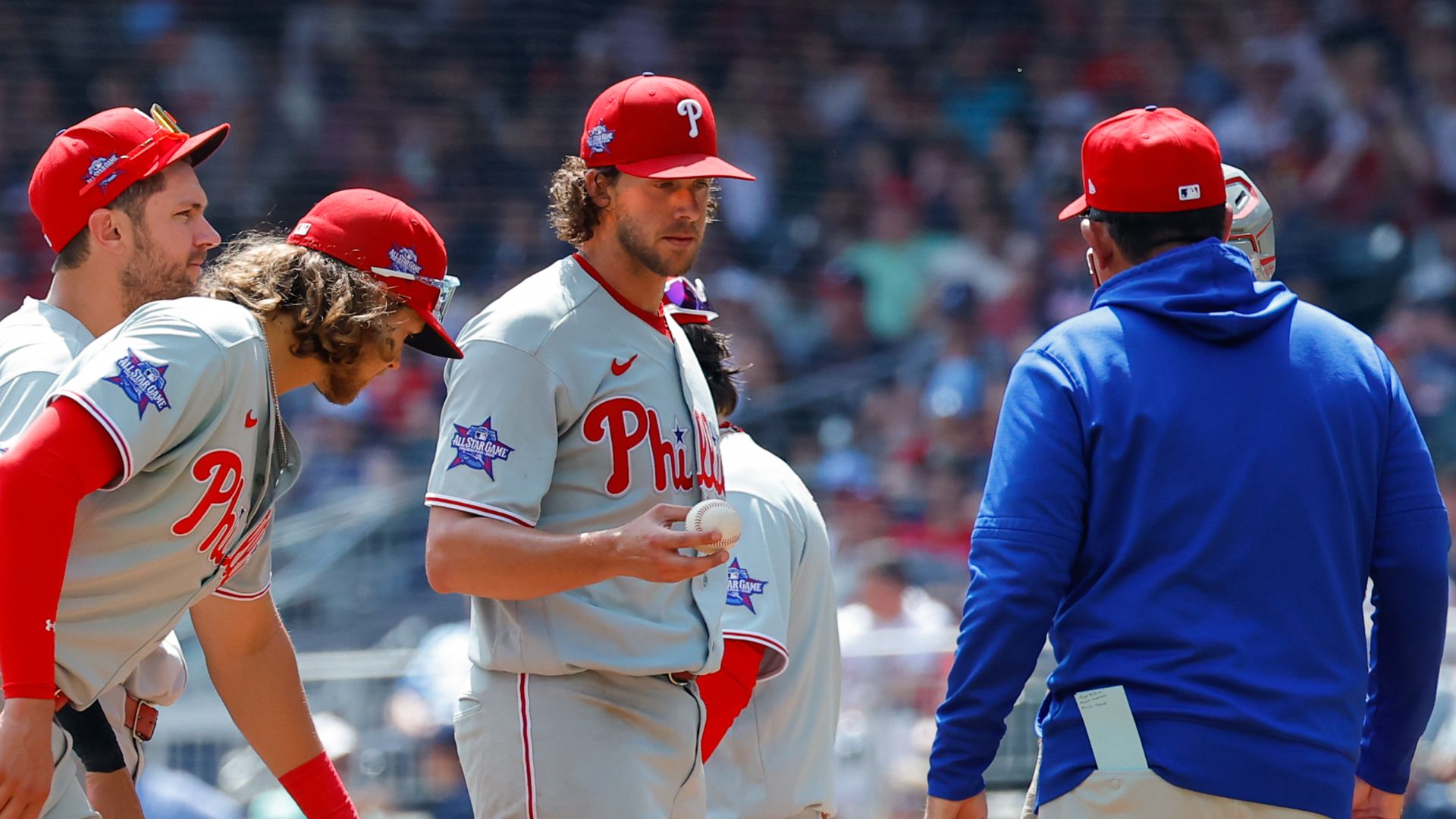 Aaron Nola hands ball to Rob Thomson