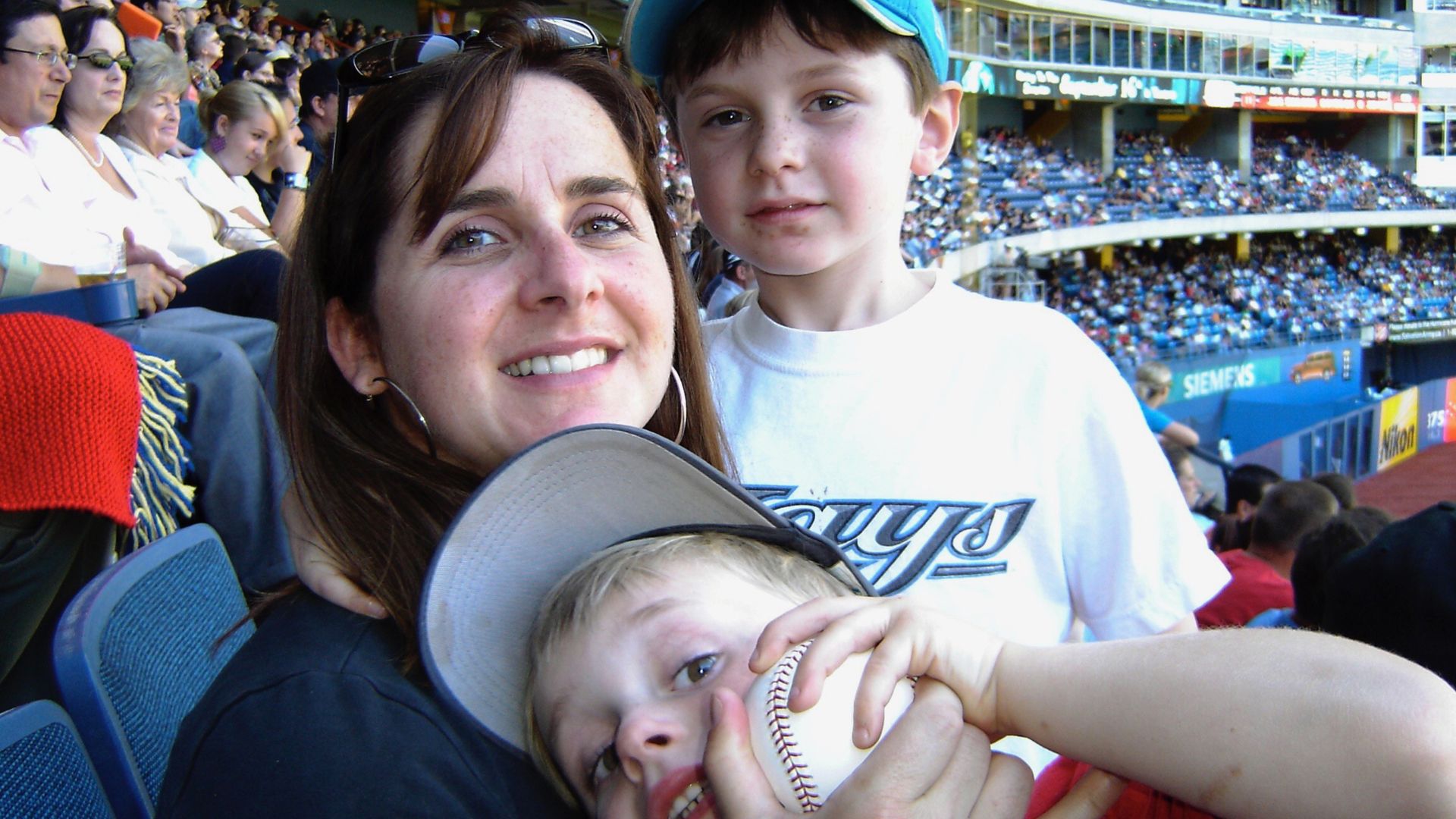 Liam Hicks, his brother and his mom at Rogers Centre