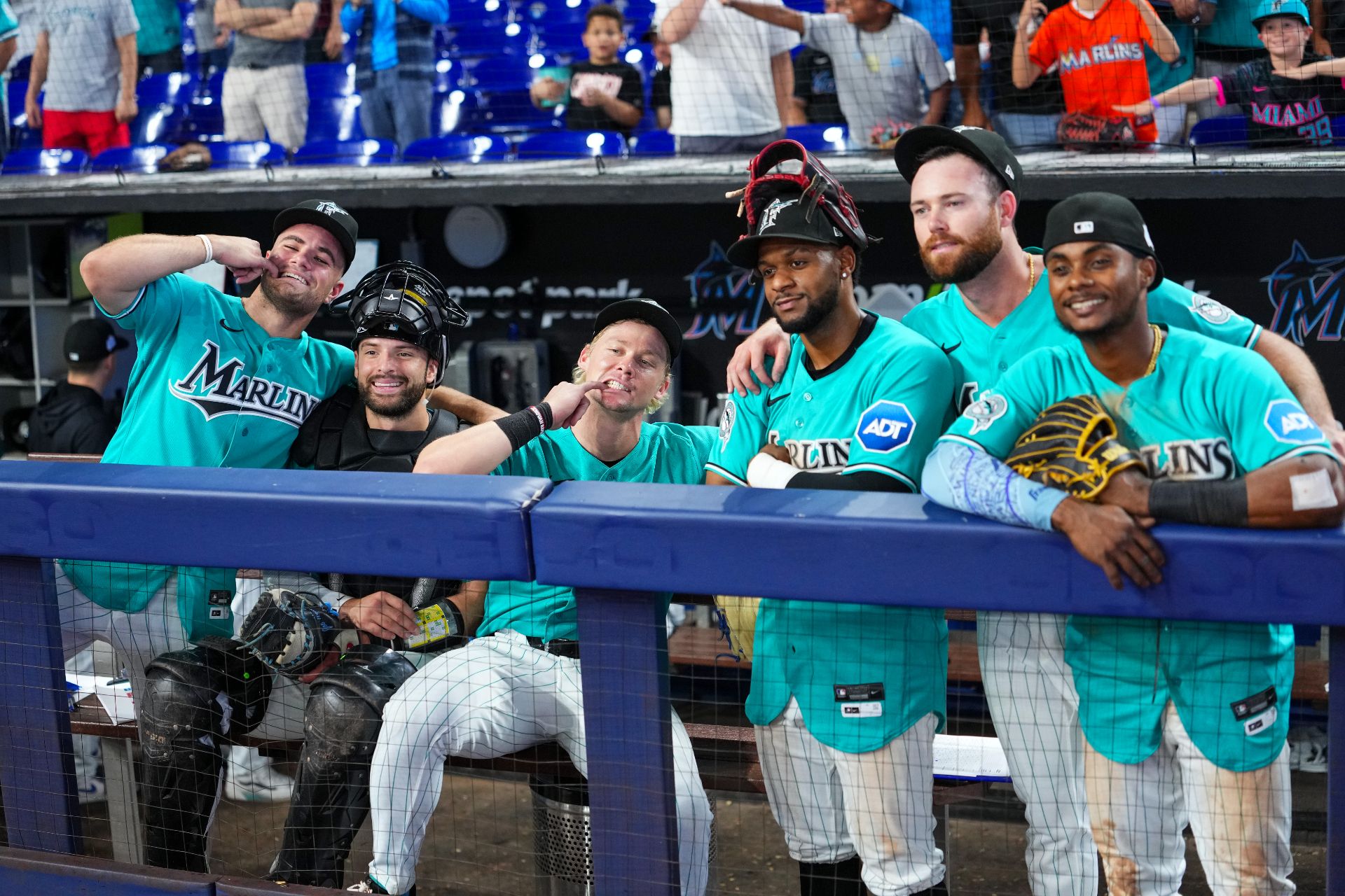 Marlins players celebrate a victory in the dugout