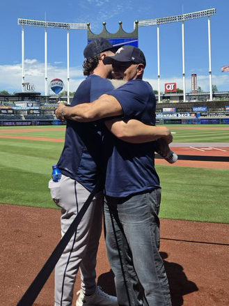 Raynel Delgado and his dad, hugging