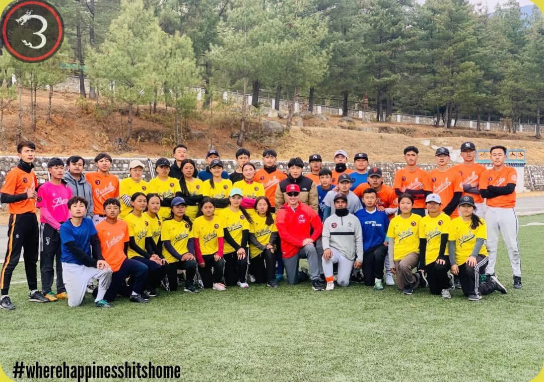 Paul Benoit, center, poses with Bhutan's baseball players. Photo courtesy Paul Benoit.