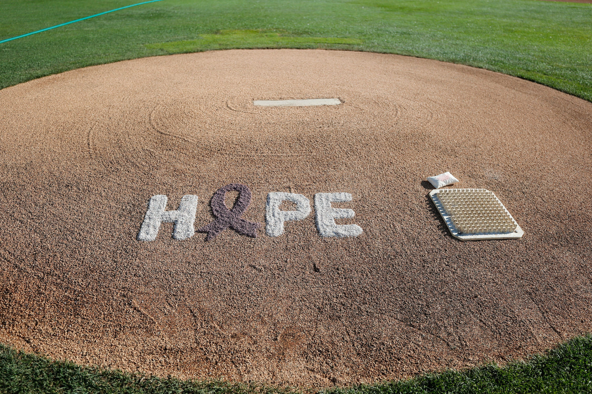 HOPE written into dirt of pitching mound